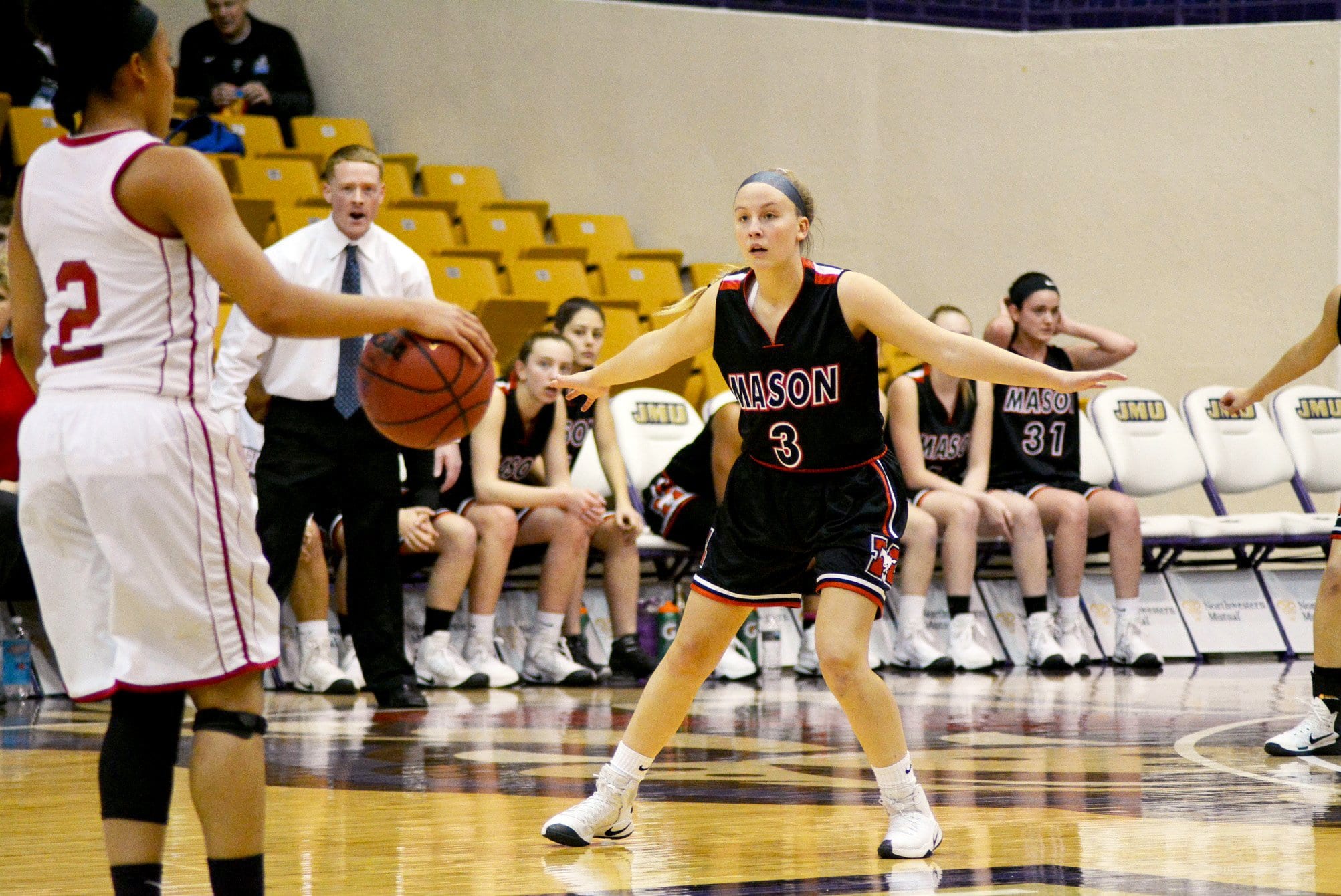 George Mason's Victoria Rund plays defense as coach Michael Gilroy watches closely from the bench in the Mustangs’ quarterfinal loss to Martinsville in the Virginia 2A state tournament last Thursday. (Photo: Carol Sly)