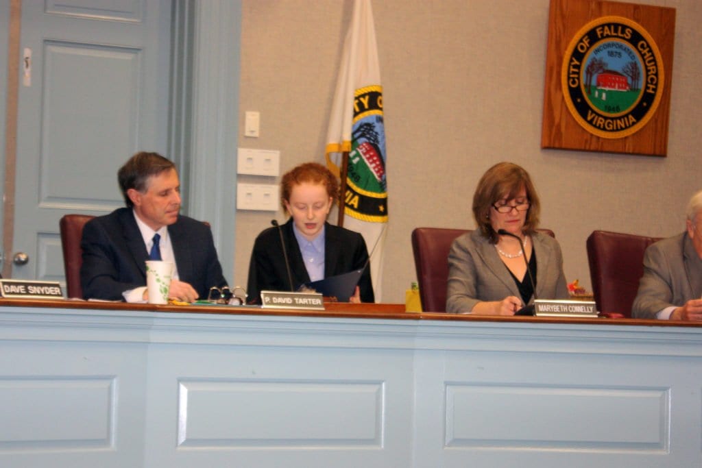 THE HONORARY MAYOR for the first part of Monday's Falls Church City Council meeting was Liv Scapia (center), honored as the regional winner of an essay for the Virginia Municipal League entitled, "If I Were Mayor." She is shown here flanked by F.C. Mayor David Tarter (left) and Vice Mayor Marybeth Connelly (right). (Photo: News-Press)