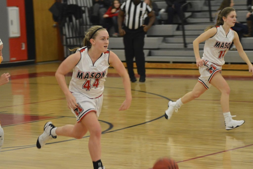 Maddie Lacroix (with ball) and Lizzy Dodge race up the court.(Photo: Carol Sly)