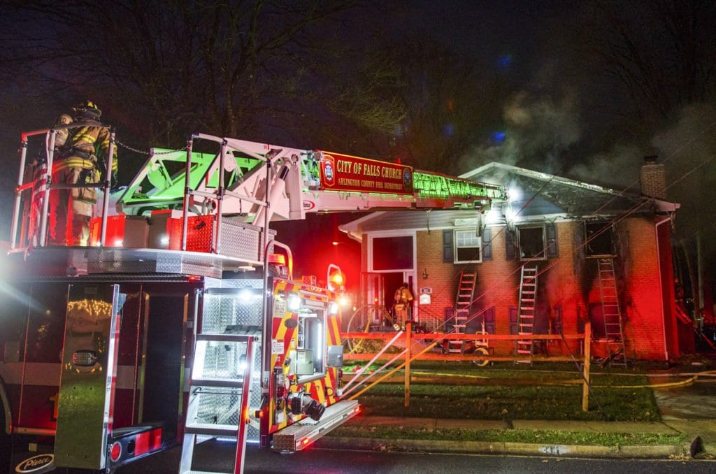 CITY OF FALLS CHURCH fIREFIGHTERS battle a blaze on Timber Lane last Saturday evening. The house fire caused $300,000 in damages and resulted in the home being condemned. (Photo: J. Michael Whalen)