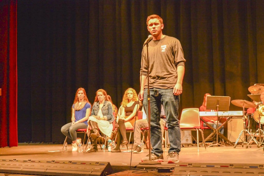 GEORGE MASON HIGH SCHOOL SENIOR Carter Findley performs a poem during the school’s Poetry Out Loud competition. He won the school competition. (Photo: Carol Sly)