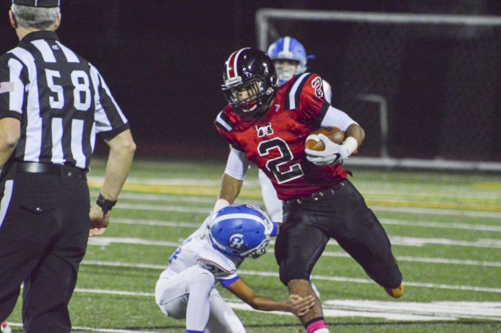 MASON SENIOR DUSTIN GREEN shrugs off a would be tackler in the Mustangs’ game against Riverside. He scored his longest rushing touchdown of the season in the Mustangs’ latest game against Warren County, which they lost. (Photo: Courtesy of FCCPS Photo/Courtesy John Roou)