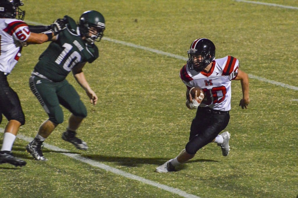 MASON SOPHOMORE JACK FELGAR carries the ball during a recent Mustang loss. (Photo: Courtesy of FCCPS Photo/John Roou)