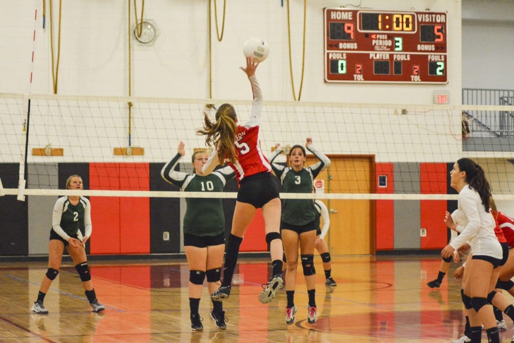 MASON SOPHOMORE RILEY RUYAK leaps up to make a play during the Mustangs’ match against William Monroe High School. (Photo: Carol Sly)