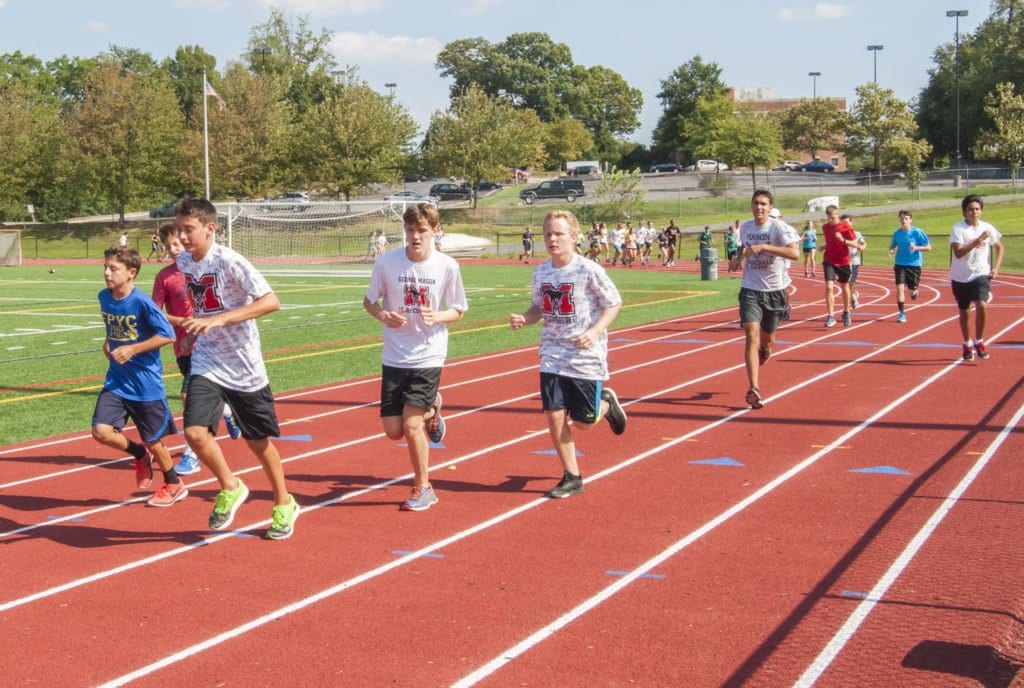 MASON’S CROSS-COUNTRY team warms up at a recent practice. The team’s first invitational is Saturday, Sept. 10 against Handley. (Photo: Drew Costley/News-Press)