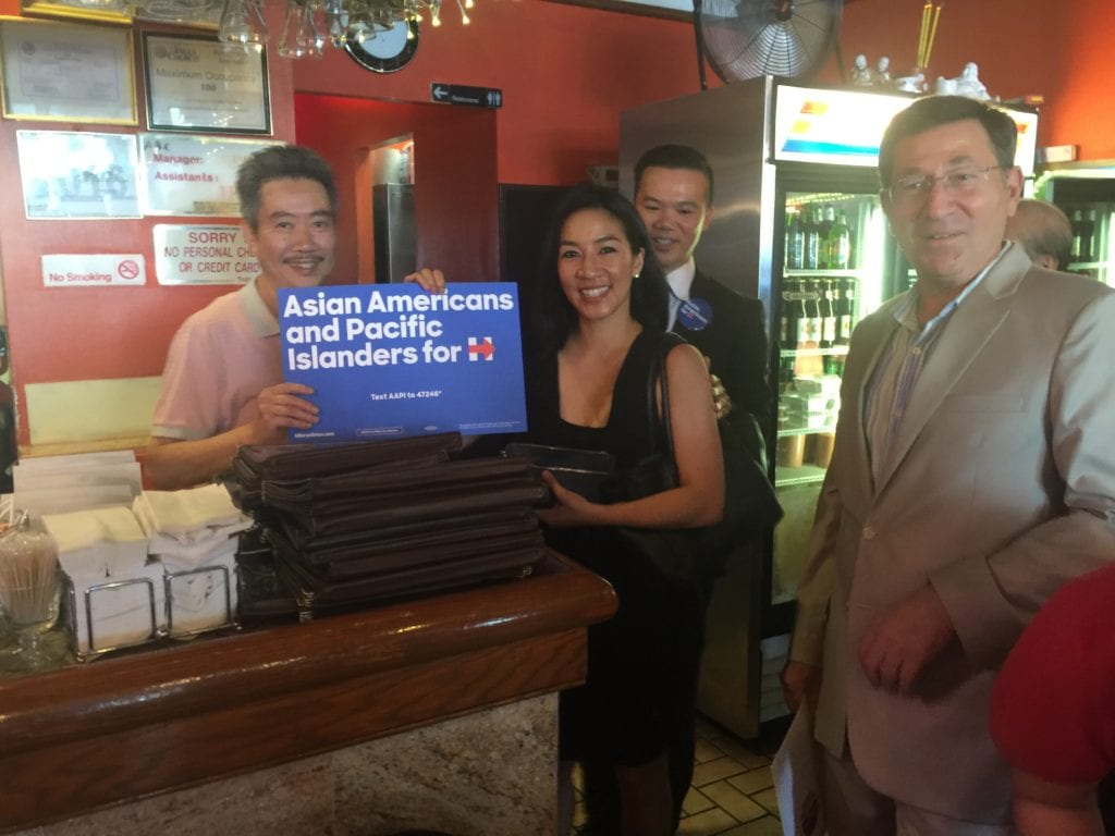 OLYMPIC FIGURE SKATER Michelle Kwan toured Falls Church's Eden Center today. She is shown here with the proprietor of the Huang Viet restaurant, with the center's manager Allen Frank on the far right. (Photo: News-Press)