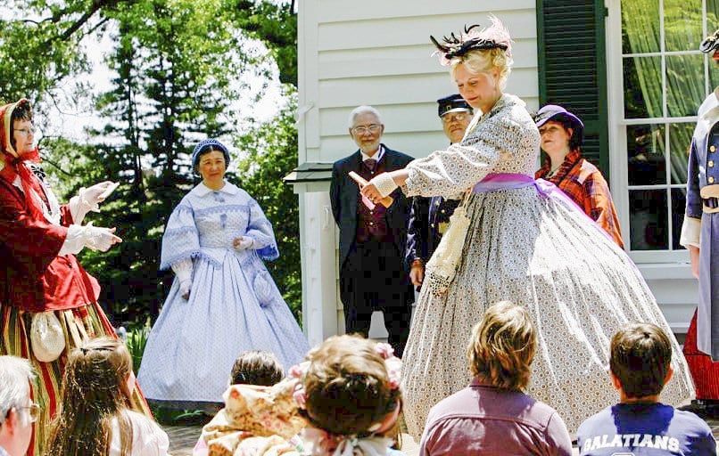 A COSTUMED DOCENT presents for a crowd during a recent Civil War Day in the City of Falls Church. The City decided to put on Living History Saturday events in August in order to make up for Civil War Day 2016, which had to be modified because of the rain. (Courtesy Photo)