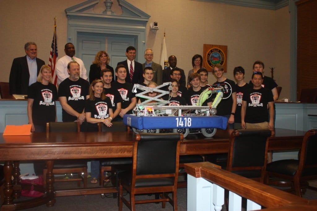 MEMBERS OF THE George Mason High School Robotics team that advanced to the world championships in St. Louis earlier this month were invited to pose with members of the Falls Church School Board Tuesday night. (Photo: News-Press)
