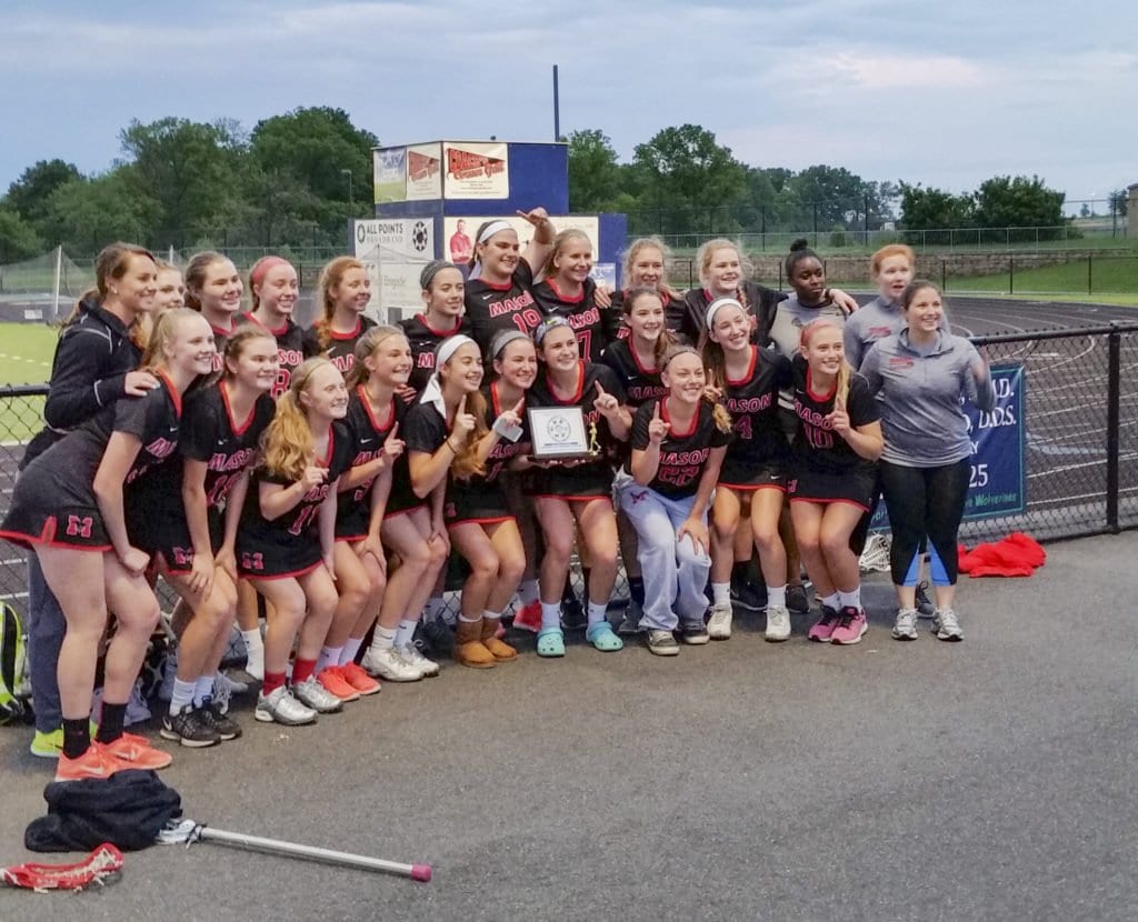 MASON’S LACROSSE TEAM celebrates their Dulles Conference Championship on Monday, May 23 after defeating Woodgrove High School, who were the defending state champs. (Photo: Courtesy of Jeffrey Wojtala)