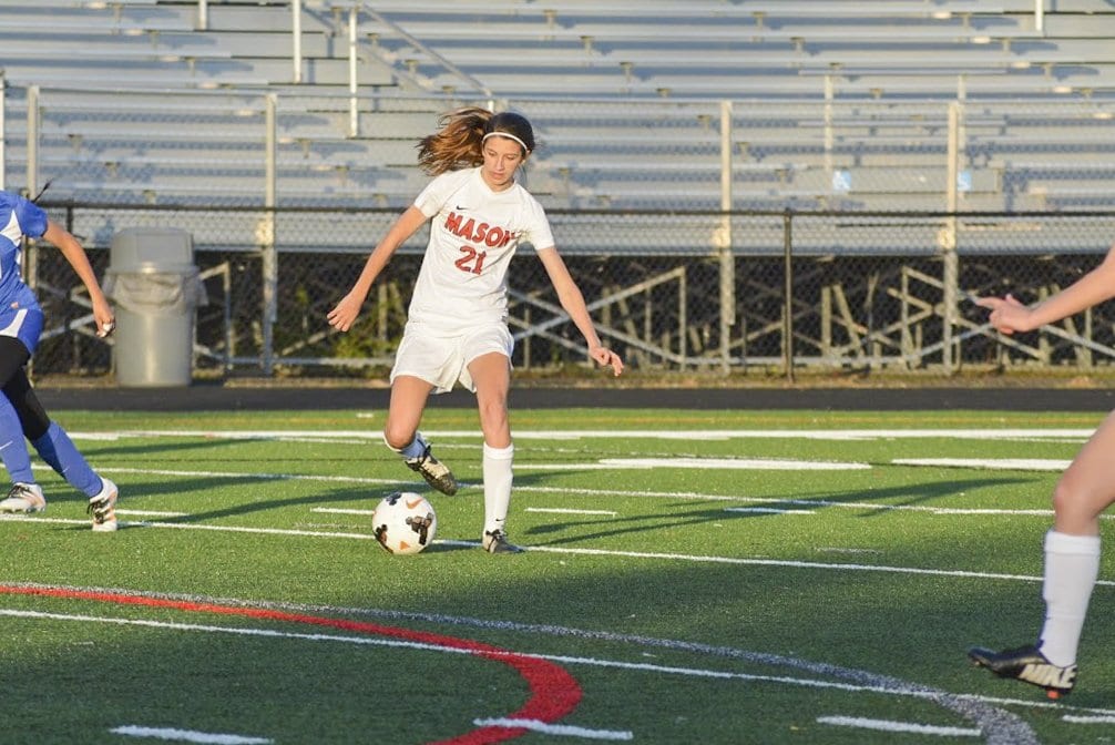 MASON SOPHOMORE IZZY ARMSTRONG dribbles the ball during a recent Mustang win. She scored a hat trick against Madison County High School. (Photo: Carol Sly)