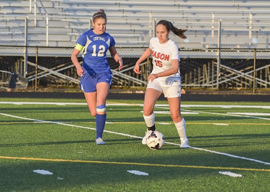 MASON SENIOR CORINNE CARSON attempts to dribble past a Central High School defender in a recent win by the Mustangs. She was part of a steady midfield that sparred against William Monroe High School in a 1-0 win. (Photo: Carol Sly)