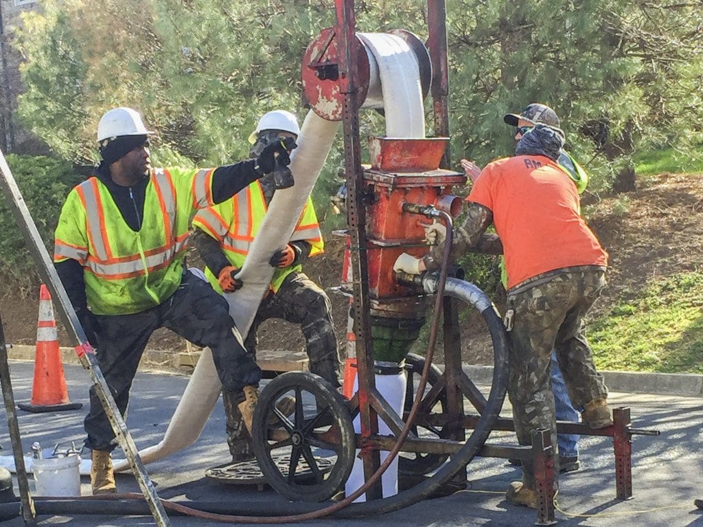 City employees LINE the piping of the sanitary sewer system on Linden Lane on March 30. (Photo: Courtesy of Lonnie Marquetti)