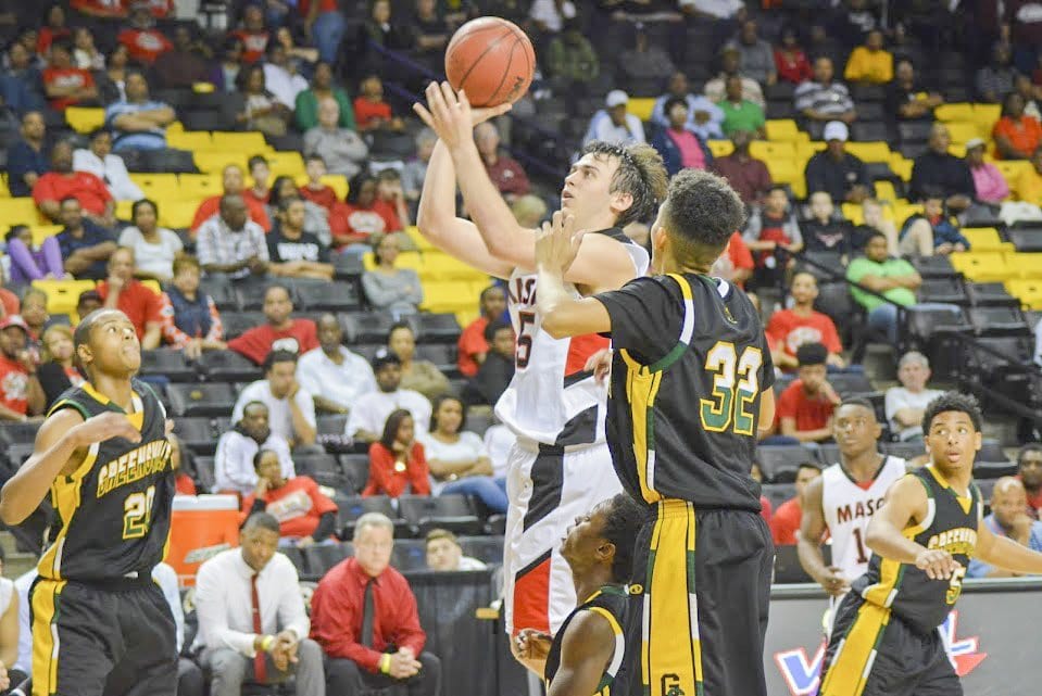 MASON SENIOR ELLIOT MERCADO hoists a shot against Greensville County High School during the Virginia High School League’s 2A state semifinal. (Photo: Carol Sly)