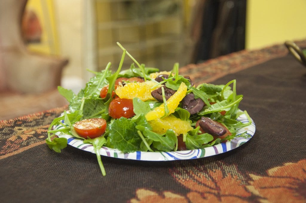 The salad in the image above is made up of leafy greens, tomatoes, kalamata olives and oranges. The salad’s dressing is made of citrus juice and olive oil. (Photo: Drew Costley/News-Press)