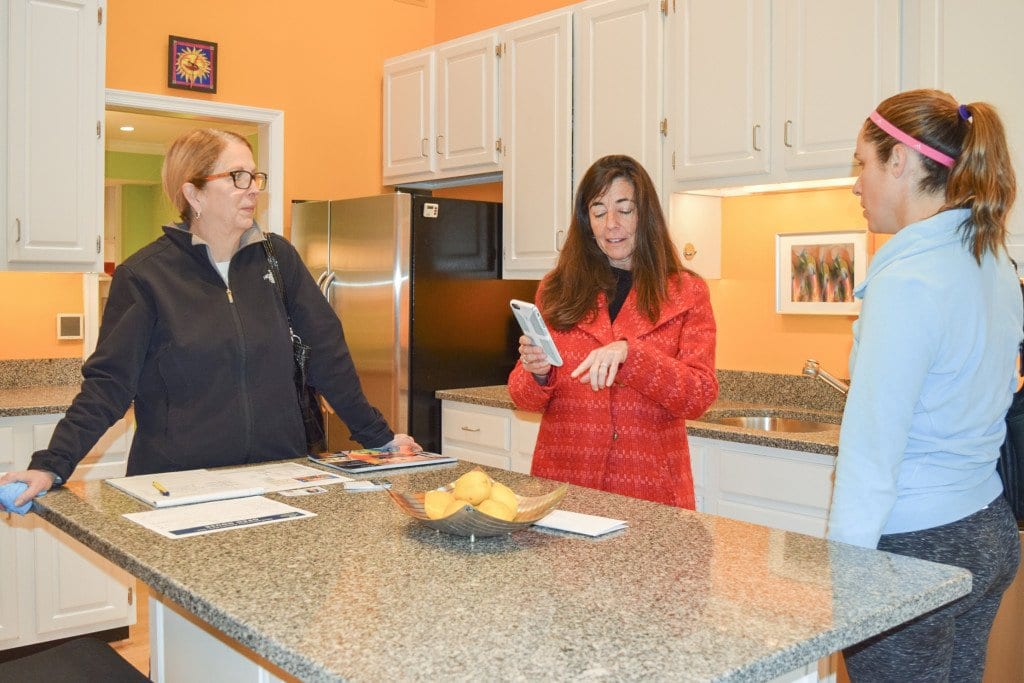Hennessey (center) speaks with potential buyers during an open house in Falls Church.. (Photo: Liz Lizama/News-Press)