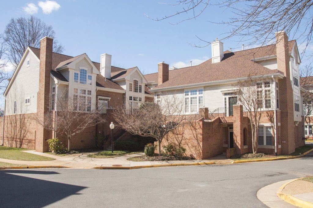 THIS TOWNHOUSE COMMUNITY is located on Haycock Road across the street from George Mason High School, the fifth highest ranked public high school in Virginia, and has two units that are listed for under $600,000. (Photo: Drew Costley/News-Press)