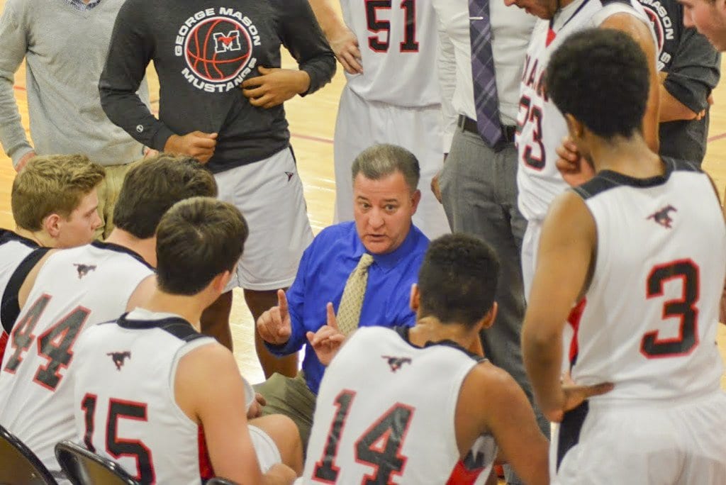 MASON COACH CHRIS CAPANNOLA TALKS to the Mustangs during a timeout. (Photo: Carol Sly)
