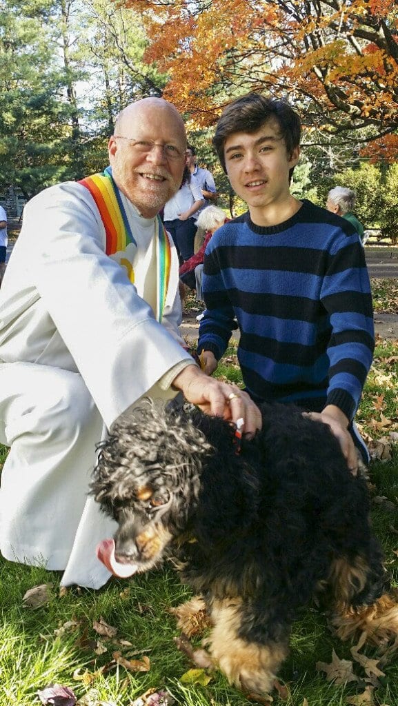 Dulin Church pastor Dave Kirkland and Brady Watts blessing a pet at last year’s Blessing of Animals. (Photo: Courtesy of Dulin Church)