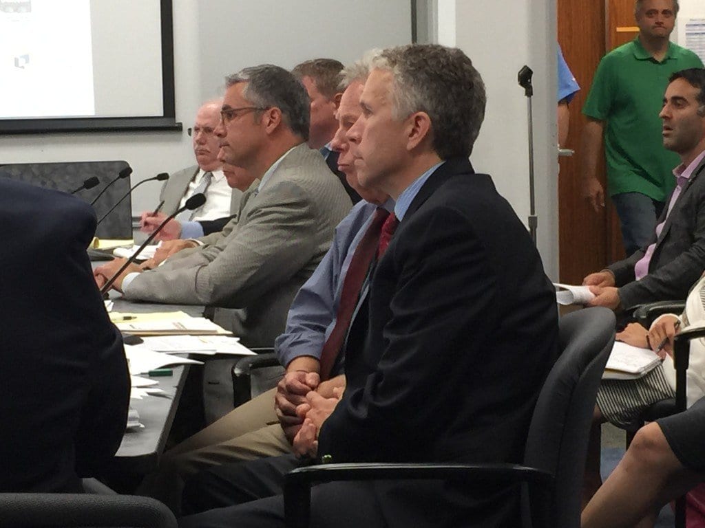 MASON ROW DEVELOPER Peter Batten (leaning forward in the center) presented the latest plan to a work session of the F.C. City Council Tuesday night. F.C. City Manager Wyatt Shields is in the foreground. (Photo: News-Press)
