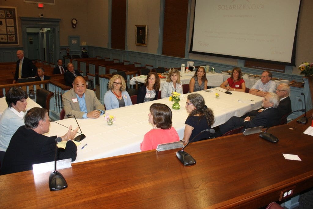 FALLS CHURCH MAYOR David Tarter, far left foreground, welcomed members of the Vienna Town Council as they joined the F.C. City Council for a shared meal in the Council chambers tonight. Vienna Mayor Laurie DiRocco is at the opposite end of the table in a red dress. (Photo: News-Press)
