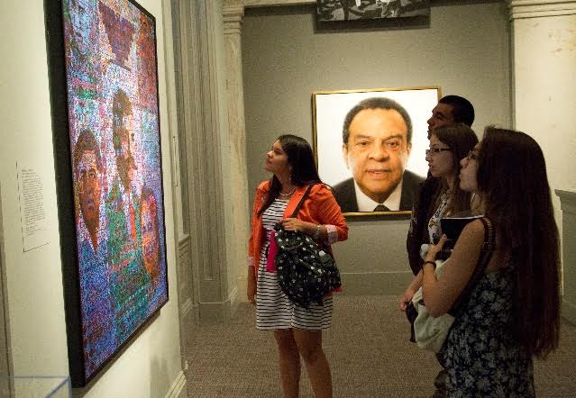 Flor Jasmin Cruz Chavez (center) checks out one of the pieces at the National Portrait Gallery, where she'll be interning this summer. (Courtesy Photo)