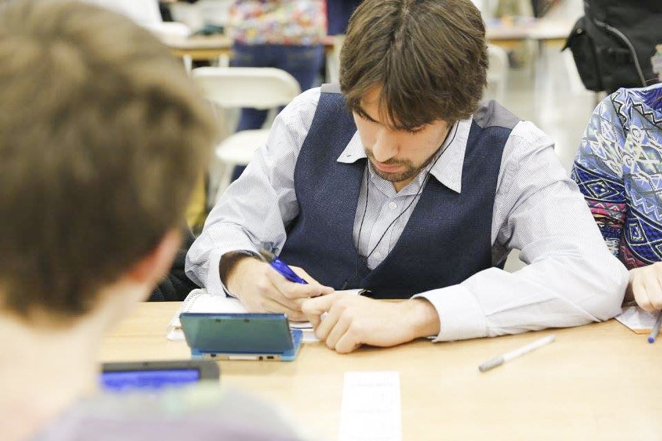 GLICK TAKES NOTES during a match at the 2015 Pokemon Winter Regional Championships. He’s been entering Pokemon competitions since 2011, when he was a freshman at McLean High School, and has won the Pokemon National Championships twice. (Photo: Courtesy of Doug Moriosoli)