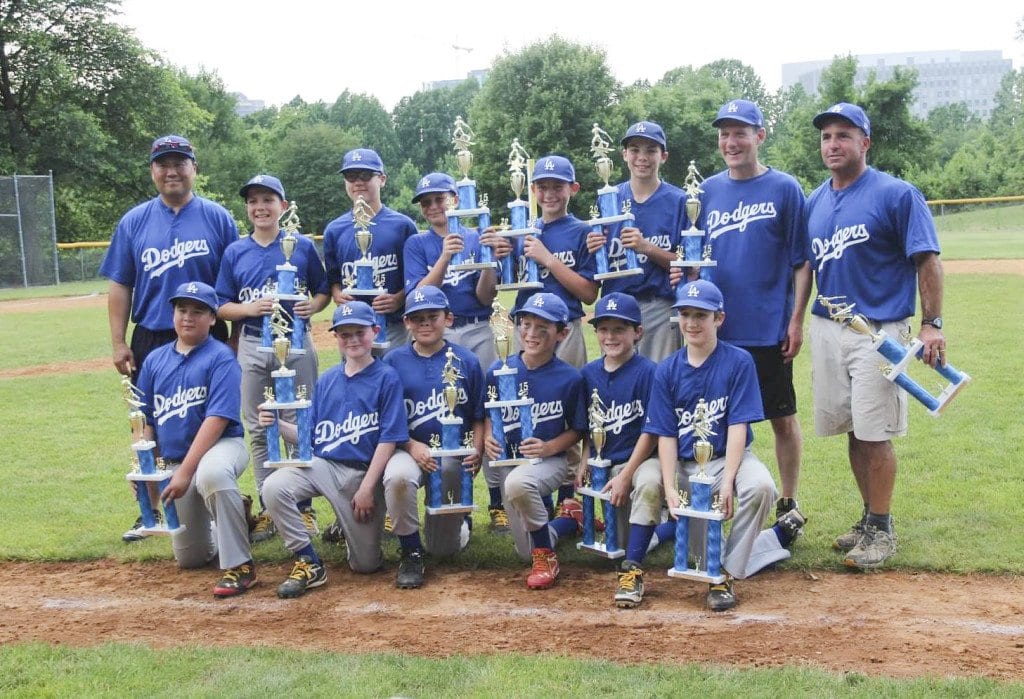THE DODGERS hold their championship trophies after defeating the Orioles 4-3 to win the Falls Church Kiwanis Little League Major divsion championship. (Photo: Courtesy of Michael Trauberman)