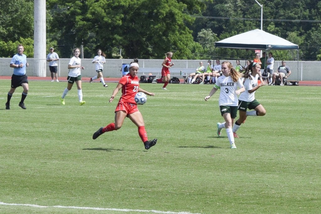 Mason sophmore Rebecca Crouch rears back against Maggie Walker’s Governor’s School during the Mustangs’ state championship victory on Saturday. (Photo: Liz Lizama/News-Press)