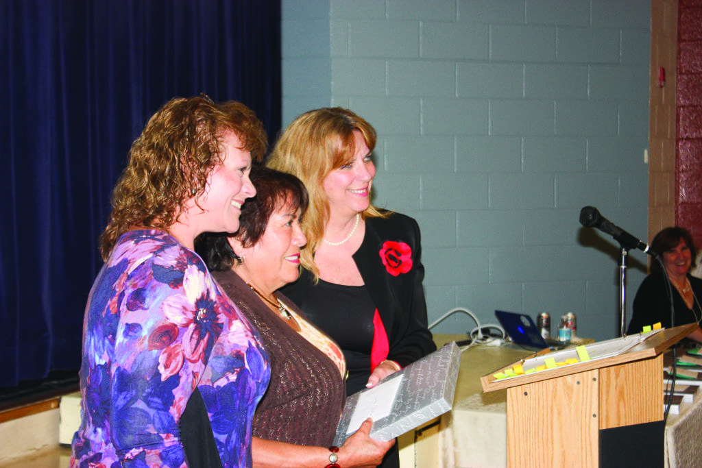 AT A SPECIAL RECEPTION to honor those retiring from employment with the City of Falls Church Schools Tuesday, Sixteen teachers and others were feted, including Yolanda Jordan (center), a long-time bus driver who was introduced by Nancy Hendrickson (left) and presented a plaque by Schools Superintendent Dr. Toni Jones (right) (Photo: News-Press)