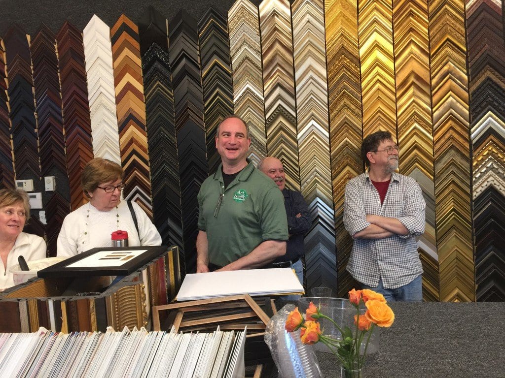 Tom Gittins (center) shows off the new Art & Frame of Falls Church locations. (Photo: News-Press)