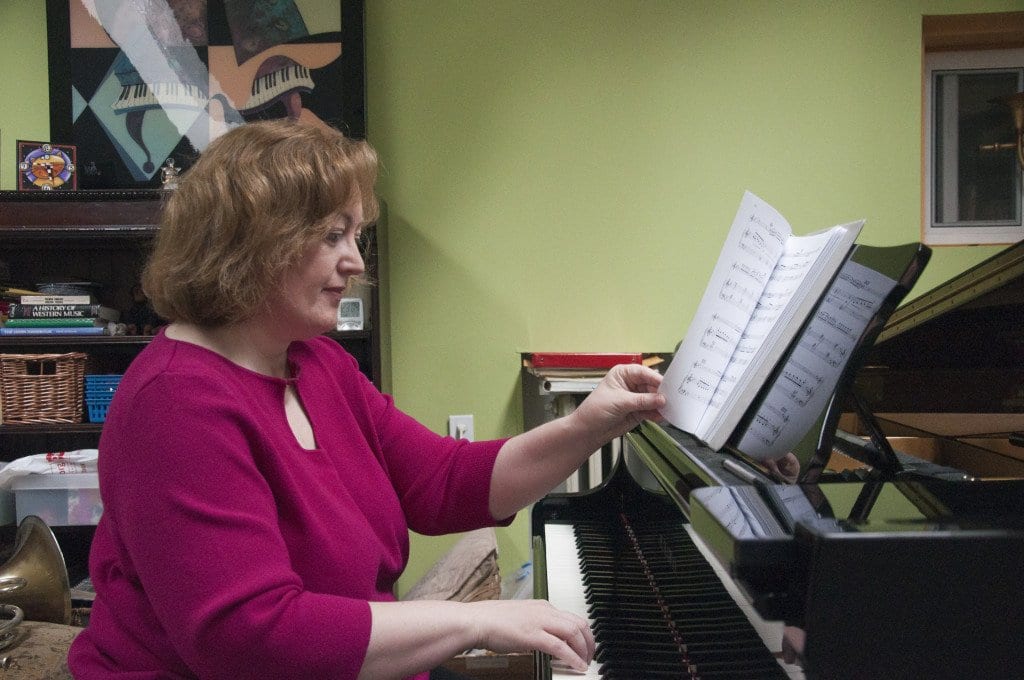 Lisa Emrich, the chair of communications for iConquerMS, practices for an upcoming performance. Emrich, who was diagnosed with multiple sclerosis in 2005, has been blogging about her experience living with the disorder since 2007. (Photo: Drew Costley/News-Press)