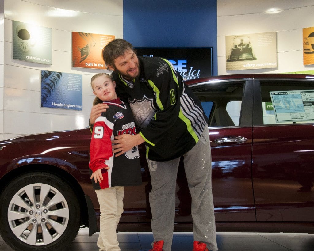Ann Schaab (left) with Washington Capitals star Alex Ovechkin at Bill Page Honda in Falls Church after Honda gave him a car to donate to the American Special Hockey Association, which Ann plays in. (Photo: News-Press)