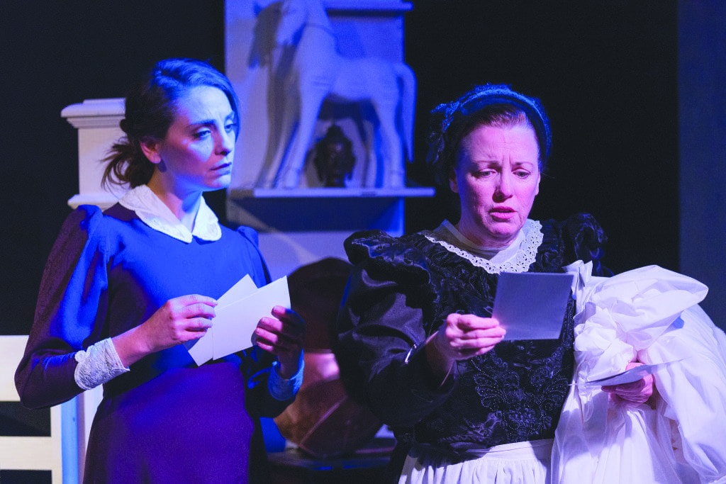 In “Turn of the Screw,” Susan Derry (left) plays Miss Giddens, who looks on while Mrs. Grose, played by Sherri Edelen, reads. (Photo: Courtesy of Keith Waters/Kx Photography)