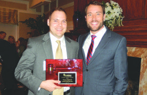 Rory Dippold (right) stands with Scott Thurman, senior political reporter for ABC7 and News Channel 8, after receiving the Golden Gavel Award from the Fairfax Law Foundation at the foundation’s annual gala last Wednesday. Earlier this year Dippold was named Teacher of the Year by Virginia National History Day. (Courtesy Photo)