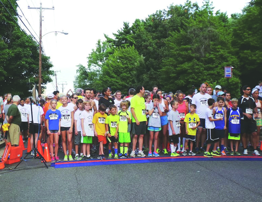 Runners get ready to take off during the Falls Church Education Foundation’s Run for the Schools 5K race and 1-mile family fun/run in 2013. The Falls Church Education Foundation (FCEF) has raised more than $100,000 through this event, which benefits the FCEF and Falls Church City Public Schools. (Photo: Courtesy of FCCPS)