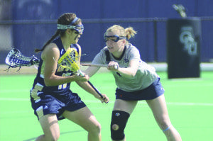 Abby Johansen (right) defends a player during one of the Old Dominion University Lady Monarch’s lacrosse games this past season. Johansen, a 2011 graduate of George Mason High School, was named to the Intercollegiate Women’s Lacrosse Coaches Association’s Academic Honor Roll last week. (Courtesy Photo)