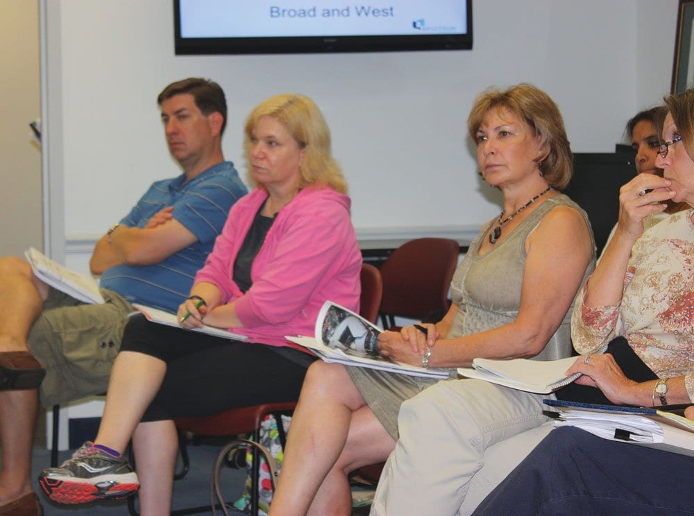 SALLY COLE (center), executive director of the Falls Church Chamber of Commerce, was present for the presentation on the Broad and N. West Street project Monday. Pending a go-ahead for more extensive community discussion expected to come this Monday, the Chamber will weigh in with its recommendations. (Photo: News-Press)
