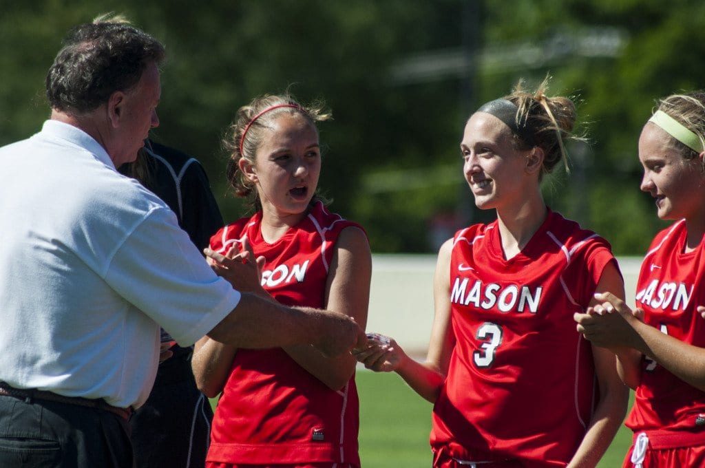 George Mason junior forward/midfielder Ava Roth accepts her first place medal from Mike Greco, the director of group 2A soccer for the Virginia High School League (VHSL). Roth scored two goals in the George Mason Mustangs 2-1 win over Maggie L. Walker's Governor's School in the VHSL 2A state championship. (Photo: Drew Costley)