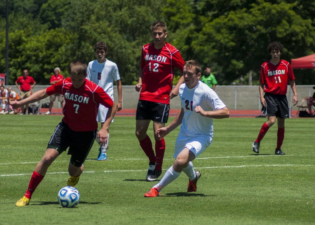 George Mason senior midfielder Paul Darmstadter dibbles around Riverheads senior defender Bruce Lamond during the scoreless first half of the George Mason Mustangs' Virginia High School League (VHSL) 2A state championship victory over the Riverheads Gladiators. Darmstadter scored the first two goals of the match. (Photo: Drew Costley)