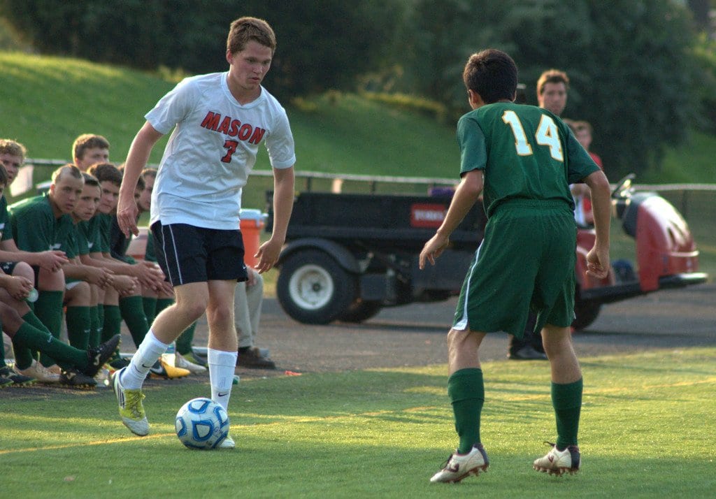 George Mason senior midfielder Paul Darmstadter gets ready to try to dribble around a player from Wilson Memorial High School in May 2013. Darmstadter has 12 goals and seven assists so far in the 2014 season. (Photo: Drew Costley)