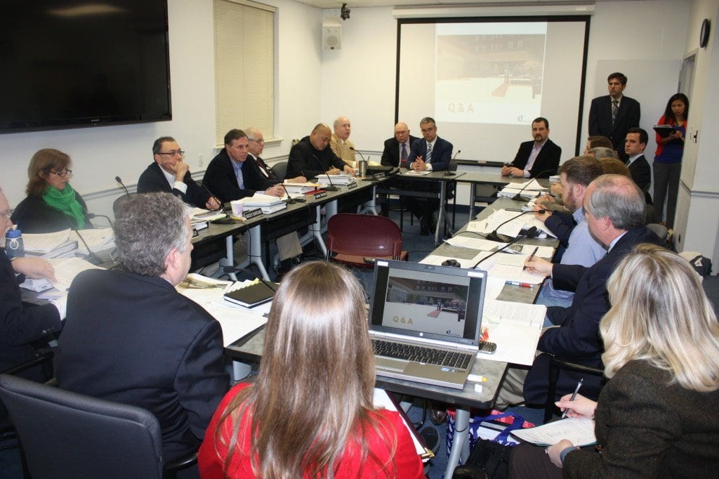 MEMBERS OF THE Falls Church City Council (left) and Planning Commission (right) crammed into the Dogwood Room at City Hall Monday night to hear and comment on the Broad & West plan presented by the Spectrum development team (center). (Photo: News-Press)