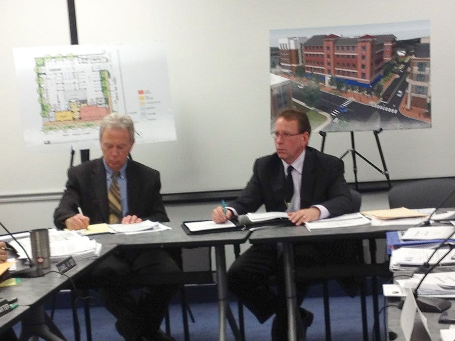 DEVELOPER ED NOVAK (seated right) presented new elements of his plans for the Kensington assisted living facility on the site of the current Burger King on W. Broad St. To his right is Rick Goff of the City’s Economic Development Office. (Photo: News-Press)