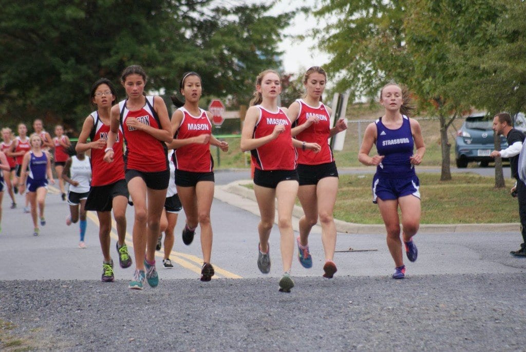 Five Mason girls were dominating the 5K course after first loop at a tri-meet at Strasburg High School last Wednesday. Pictured above, from left to right, are eighth-graders Logan Funk and Estelle Timar-Wilcox; sophomores Grace Eye and Blaise Sevier; and junior Kaitlin Kutchma. (Photo: Courtesy Carol Sly)