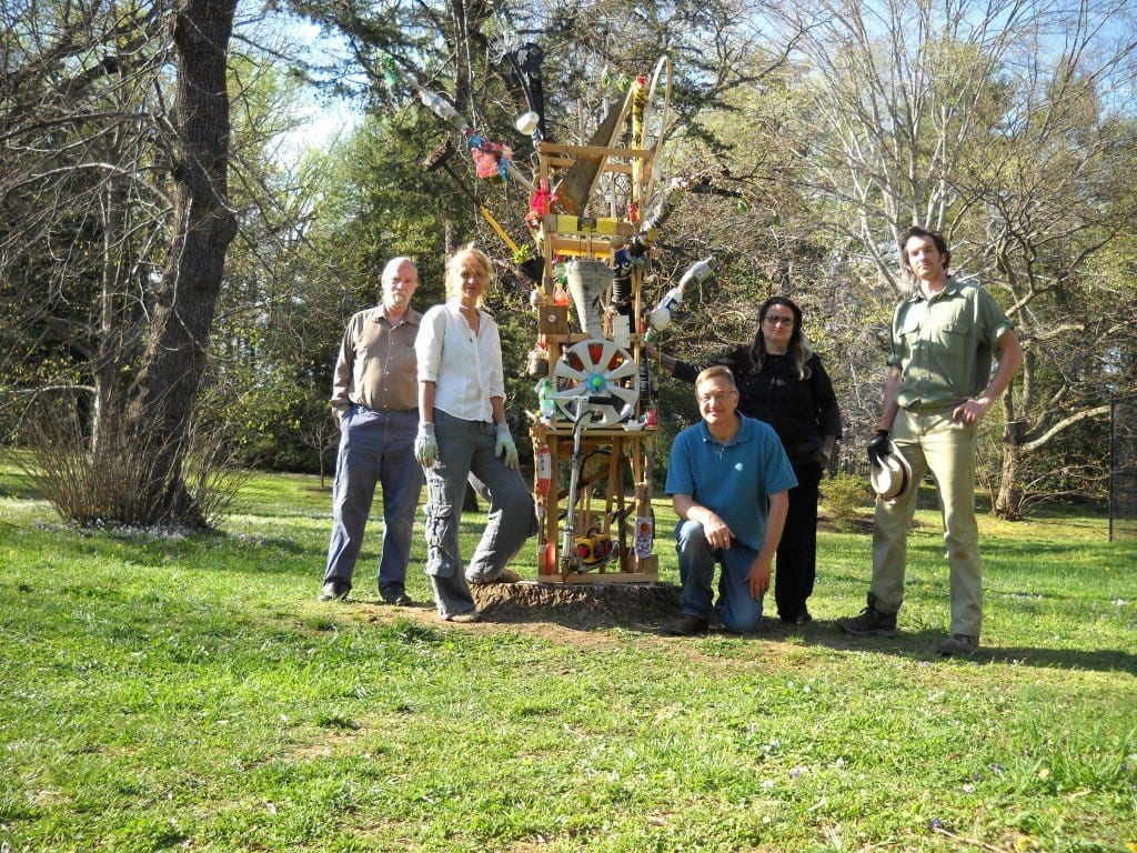 Local eco artists are seen above with their work before moving it to the Falls Church Community Center. Pictured above, from left to right, are Gregory Bryant, Isabelle Babington, John Maier, Llori Stein, and Teddy Wiant. Not pictured are Bill Nell, Olivier Giron, Jacqlyn Sickler and their Falls Church Arts supporters, Bill Abel and Marc Masurovsky. (Photo: Courtesy Llori Stein)
