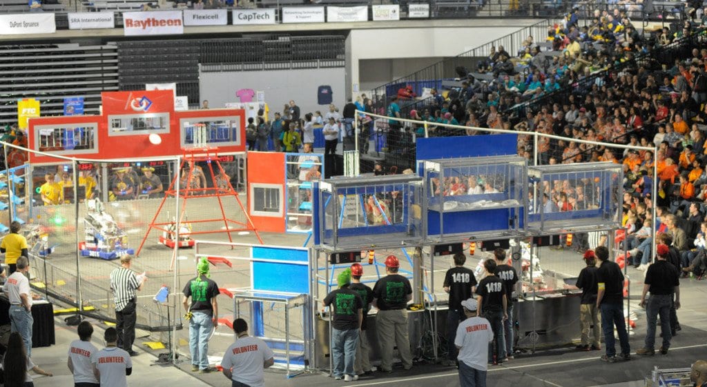 Team 1418 from George Mason High School guides its robot through an event at the FIRST Robotics Virginia Regional Tournament last weekend. The team made it into the semifinals of the competition. (Photo: Arthur W. Pierson)