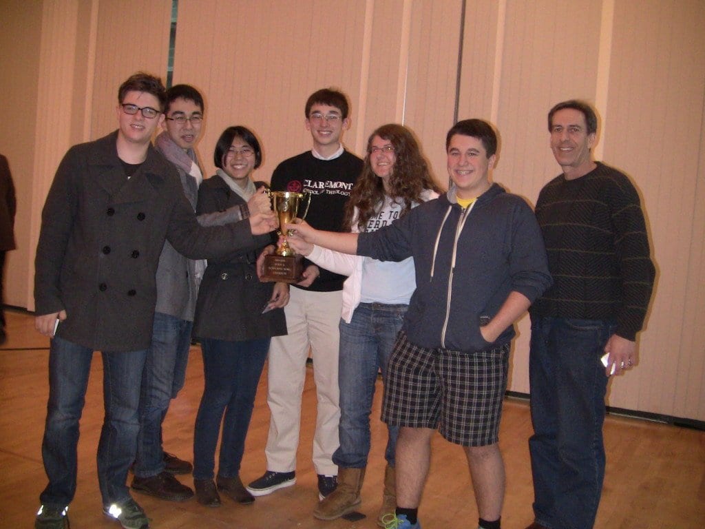 George Mason High School’s scholastic bowl team (with coach Jamie Scharff, far right) is pictured above with its state tournament trophy. George Mason has won the state championship the past four years. (Photo: Courtesy Susan Earman)