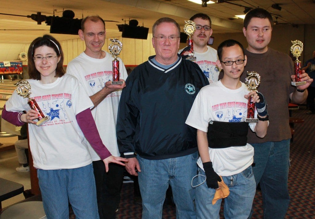 Five Special Olympians receive Outstanding Performance awards from Fairfax Adult Softball President John Carney. FAS held its annual bowling tournament last Sunday and raised almost $14,000 to benefit Northern Virginia Special Olympics and Fairfax County Park Authority field improvements. (Courtesy Photo)