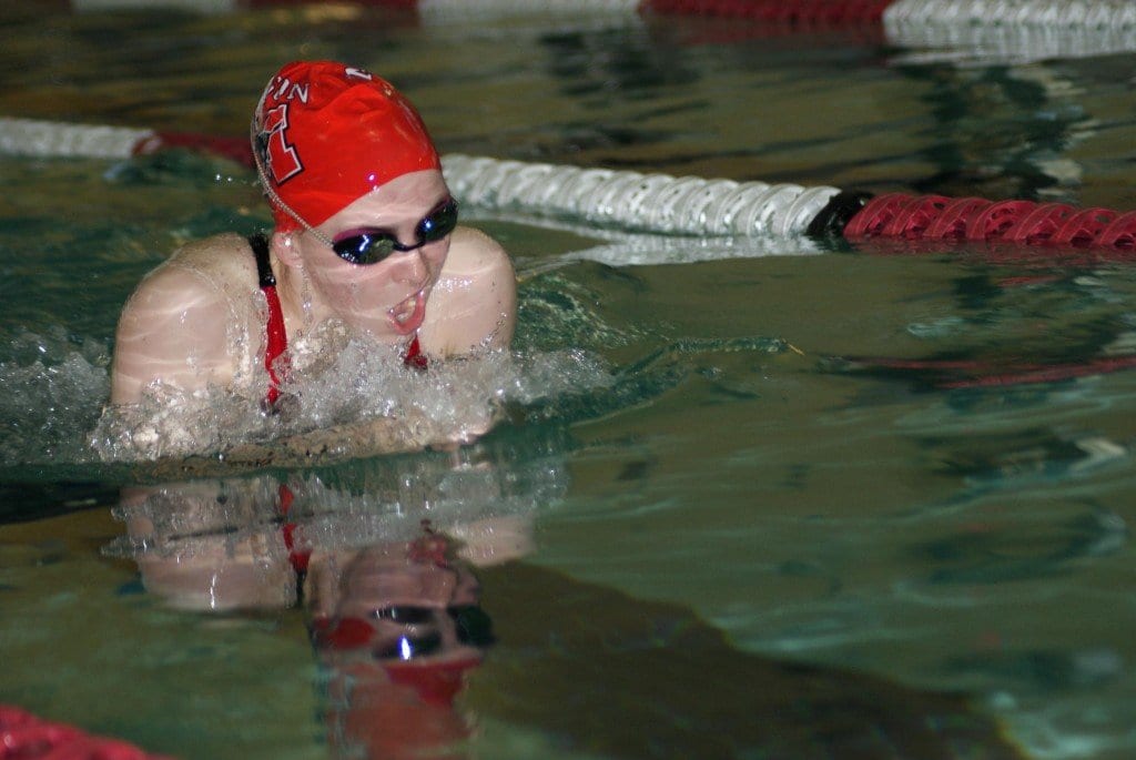 Sophomore Beth Cashin swims the 100-yard breaststroke to a winning time of 1:11.99. (Photo: Carol Sly)